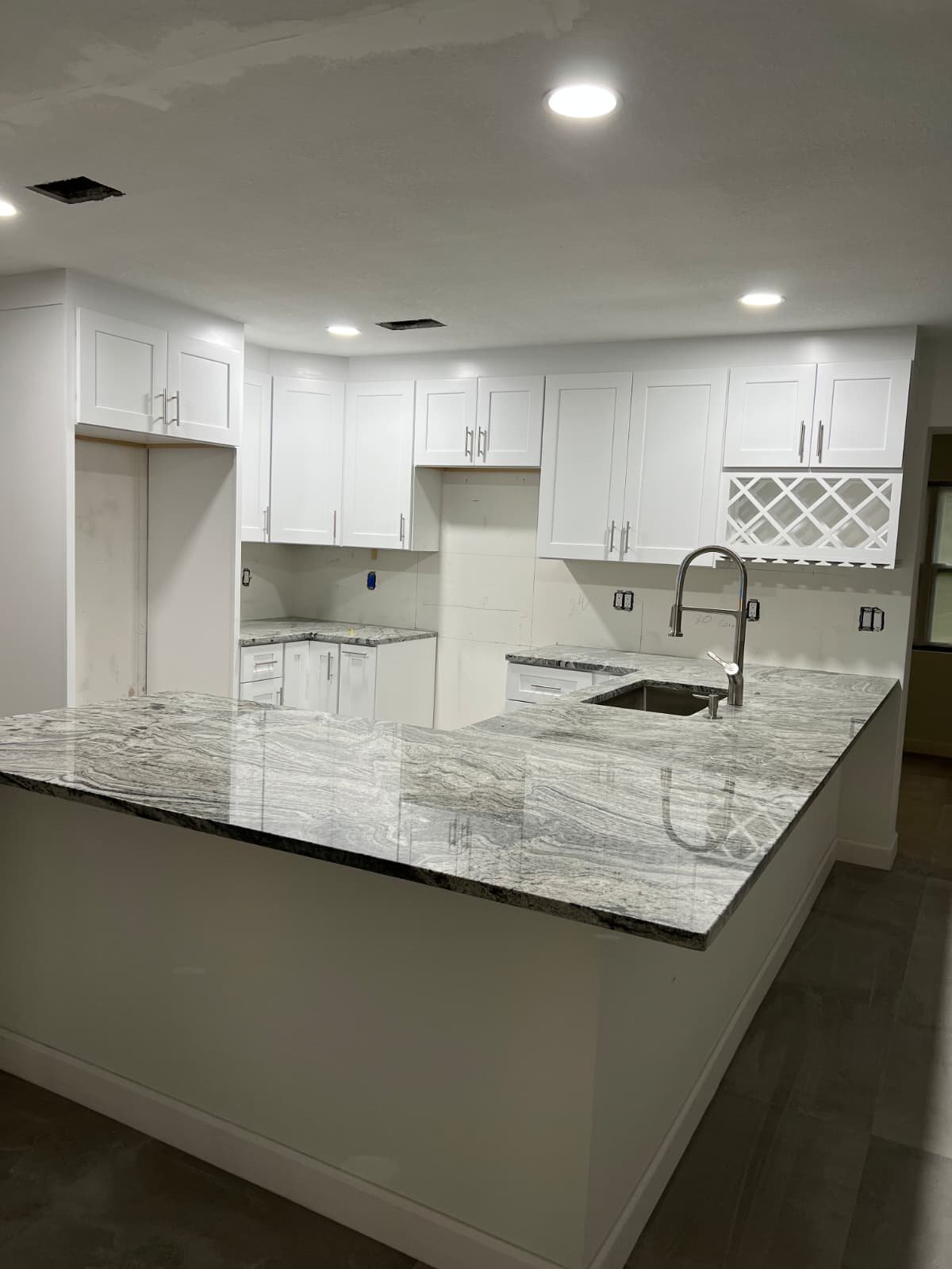 White shaker kitchen with brass hardware
